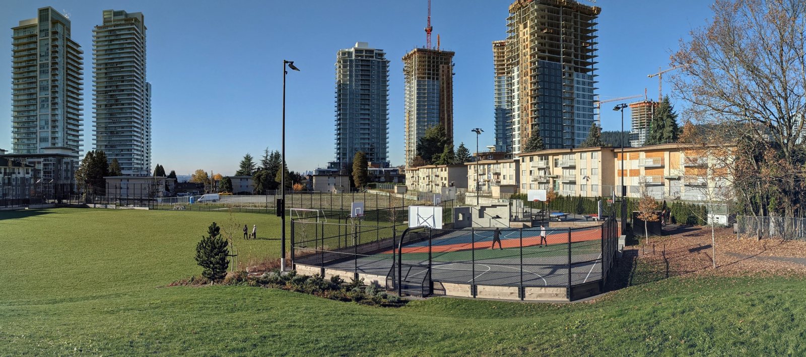 A park in Burquitlam, with the towers behind