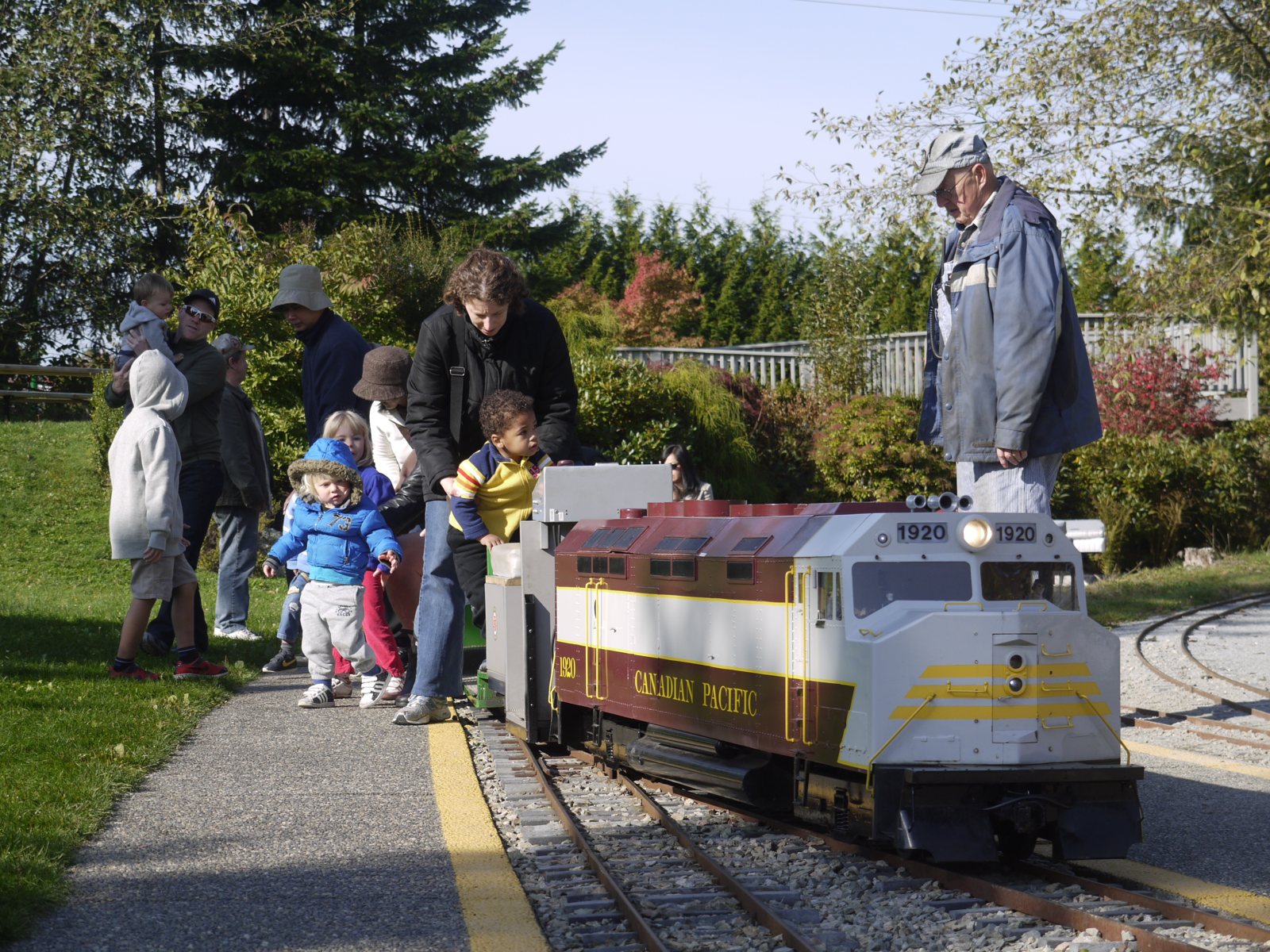 Kids boarding the miniature train at Confederation Park